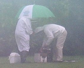 Attempting beekeeping in the heavy rain, Photo.... Chris Slade