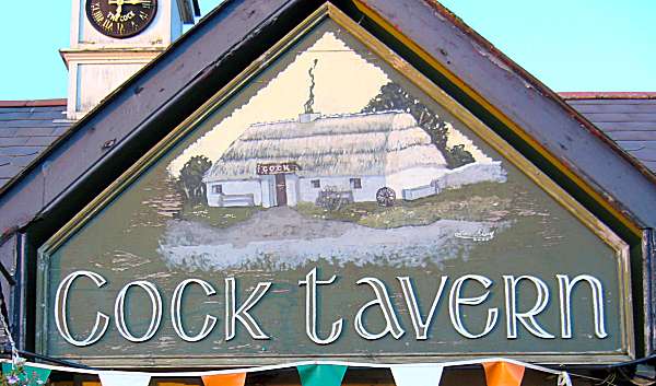 main gable of the Cock Tavern depicting old thatched inn