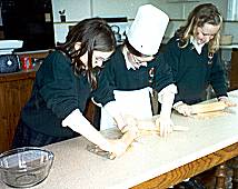 Siobhra Aikin, Sarah Reynolds and Belinda Clarke Crushing digestive biscuits
